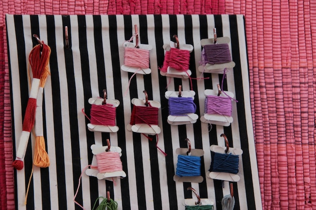 Three sample embroidered products displayed